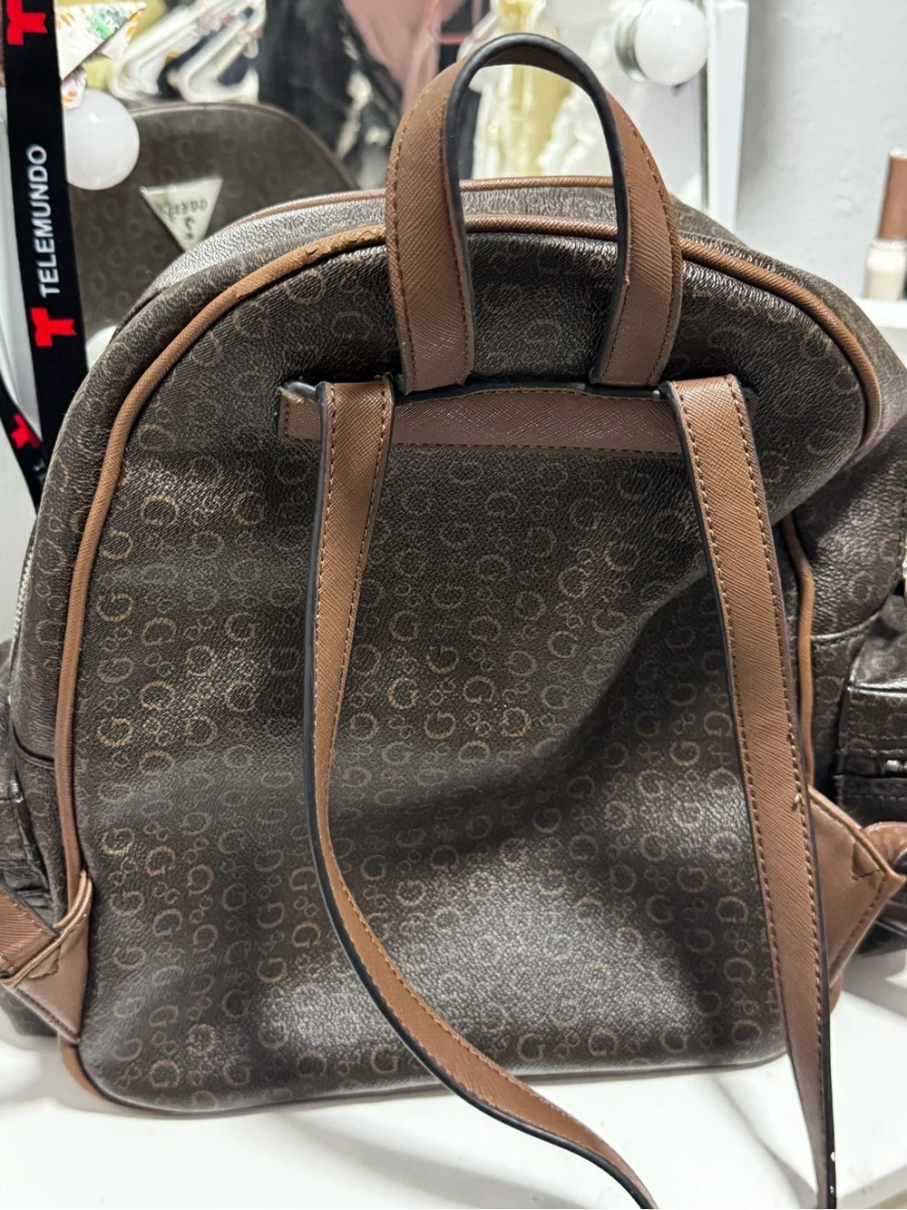 GUESS Brown Monogram Mini Backpack with Silver Logo
